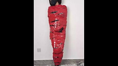 NANA Mummified with Red Plastic Tape and then Played with for Orgasms